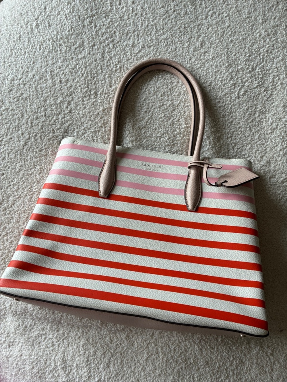 Like new Kate Spade bag. Red, pink & white striped.